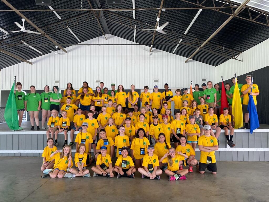 youth in a group wearing yellow t-shirts