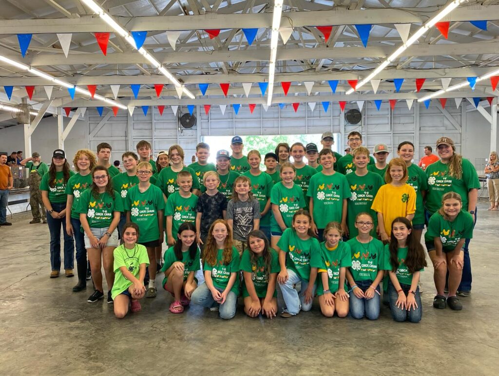 Group of youth wearing 4-H Chick Chain t-shirts